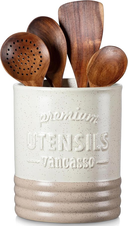 Matte cream ceramic utensil crock holding wooden spoons